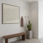 Minimalist textured hand-painted canvas in cream and sand tones with subtle horizontal brushwork, contemporary entryway