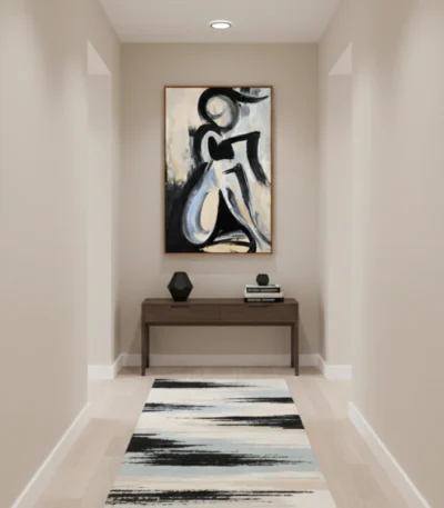 Gestural abstract expressionist hand-painted canvas depicting seated figure in black and cream tones, contemporary hallway