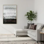 Layered abstract hand-painted canvas in monochrome blacks, whites and grays with gestural vertical brushstrokes, contemporary living space