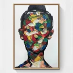 Gestural abstract hand-painted canvas depicting a portrait head in vibrant multicolored brushstrokes and layered impasto, contemporary living space