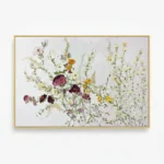 Impressionist hand-painted canvas of wildflowers and botanicals in burgundy, yellow, and soft pastels, displayed in a contemporary space