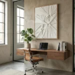 Textured abstract hand-painted canvas with radiating linear patterns in cream and taupe, modern workspace