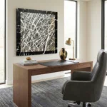 Gestural abstract expressionist hand-painted canvas in black, white and gold with dynamic layered brushstrokes, modern office setting