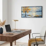 Impressionist landscape hand-painted canvas depicting golden autumn tree by serene snow-dusted lakeside, cool blue and warm ochre tones, contemporary office setting
