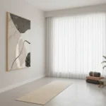 Minimalist abstract hand-painted canvas with organic shapes in charcoal, cream, and black, contemporary studio space