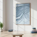 Gestural abstract hand-painted canvas depicting flowing blue and white wave patterns in layered brushstrokes, modern minimalist space