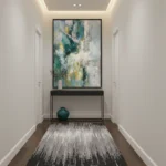Abstract expressionist hand-painted canvas in teal, cream, and soft yellow gestural strokes, contemporary hallway