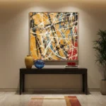 Abstract expressionist hand-painted canvas with dynamic white gestural strokes, warm ochre and deep navy palette, contemporary entryway