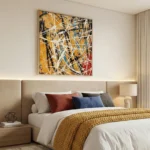 Gestural abstract expressionist hand-painted canvas in ochre, black, white, and cobalt with dynamic linear brushstrokes, modern bedroom
