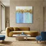 Contemporary abstract hand-painted canvas with golden foliage and blue gradient vertical strokes, modern living space