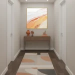 Gestural abstract hand-painted canvas in warm terracotta, ochre and cream tones, entryway setting