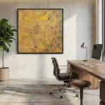 Textured abstract expressionist hand-painted canvas in golden yellow with blue and red gestural marks, contemporary office space