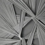 Textured abstract hand-painted canvas featuring interwoven ribbon-like forms in monochrome grays and blacks, contemporary space