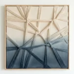 Textured abstract hand-painted canvas with interwoven natural fiber strands in cream, sage, and deep navy gradient, contemporary white room