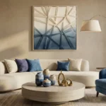 Layered abstract hand-painted canvas in cream and deep blue tones with gestural line work, contemporary living space