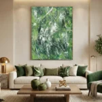 Gestural abstract hand-painted canvas in layered greens and white with dynamic brushstrokes, contemporary living space
