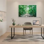 Impressionist landscape hand-painted canvas depicting lush tree-lined pathway in vibrant greens and dappled light, modern home office