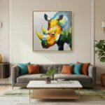 Gestural abstract hand-painted canvas depicting a colorful geometric rhinoceros in vibrant yellow, orange and teal tones, contemporary living space
