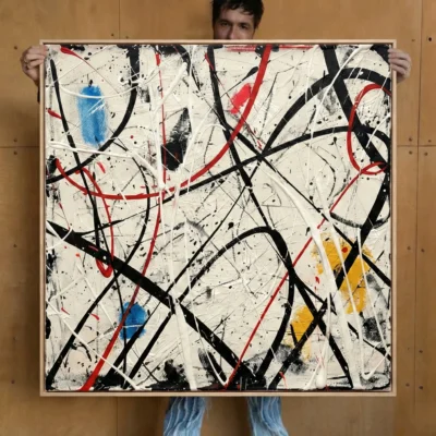 Abstract expressionist hand-painted canvas with dynamic black and red gestural strokes, blue and yellow accents, cream background