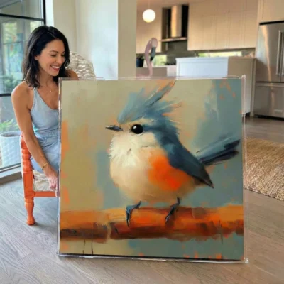 Painterly contemporary wall art depicting a blue-crested robin with vibrant orange breast on warm ochre branch, muted sage and terracotta palette, modern kitchen setting