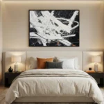 Abstract expressionist hand-painted canvas with dynamic white gestural strokes and black layered composition, modern bedroom