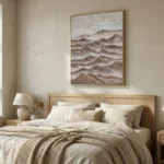 Textured landscape hand-painted canvas depicting layered mountains in warm earth tones and cream, modern bedroom