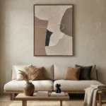 Minimalist abstract hand-painted canvas with organic curved forms in cream, taupe, and black tones, contemporary living space