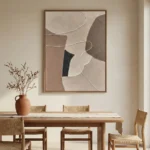 Minimalist abstract hand-painted canvas in layered cream, taupe and charcoal organic forms, contemporary dining space