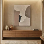 Minimalist abstract hand-painted canvas in layered beige, taupe and charcoal tones, contemporary entryway