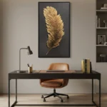 Textured gold leaf hand-painted canvas depicting a single feather in warm metallic tones on charcoal ground, contemporary office setting