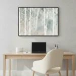 Textured abstract hand-painted canvas in soft whites and muted sage tones with vertical gestural marks, modern workspace