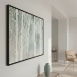 Textured abstract hand-painted canvas in soft greens and whites with weathered surface detail, contemporary living space