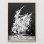 Gestural abstract expressionist hand-painted canvas in dramatic black and white with dynamic sweeping brushstrokes, contemporary living space