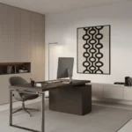 Minimalist black and cream hand-painted canvas with geometric interlocking circles pattern, contemporary office space