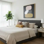 Minimalist abstract hand-painted canvas with stacked organic shapes in blush, cream, and ochre tones, modern bedroom