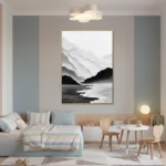 Minimalist landscape hand-painted canvas depicting misty mountains and coastline in monochrome black and white, modern bedroom setting