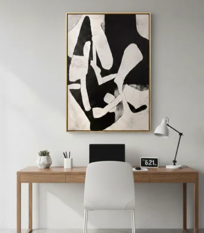 Gestural abstract hand-painted canvas in bold black and cream, dynamic organic forms, contemporary workspace