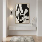 Abstract hand-painted canvas in bold black and white organic shapes, contemporary entryway