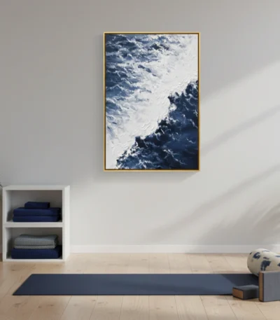 Contemporary landscape hand-painted canvas depicting snow-capped mountains and dramatic clouded sky in deep blues and whites, yoga studio setting
