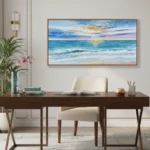 Impressionist seascape hand-painted canvas depicting golden sunset over turquoise waves and sandy shore, warm and cool tones, contemporary workspace