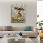 Gestural figurative hand-painted canvas depicting woman with rust-red umbrella in gold dress, muted earth tones and weathered texture, contemporary living space