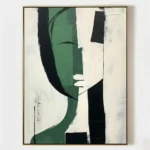 Abstract hand-painted canvas with gestural green and black forms on cream, contemporary living space