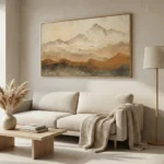 Layered landscape hand-painted canvas depicting misty mountains in warm earth tones and soft ochre, contemporary living space