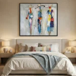 Gestural abstract hand-painted canvas depicting three stylized figures in vibrant multicolor palette, modern bedroom setting
