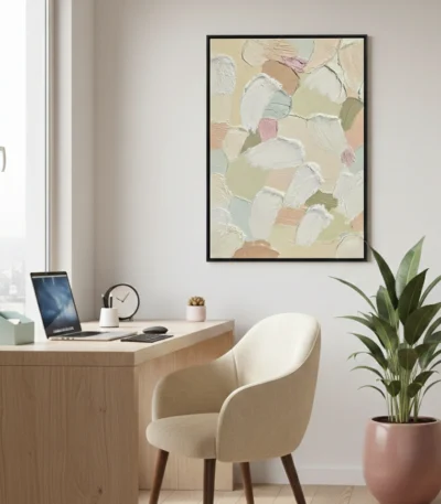 Textured abstract hand-painted canvas in soft pastels and cream tones with gestural brushwork, contemporary office setting