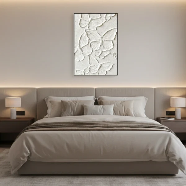 Textured abstract hand-painted canvas with layered white botanical relief forms in monochrome, modern bedroom setting