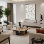 Textured abstract hand-painted canvas with embossed botanical leaf motifs in ivory and cream, contemporary living space
