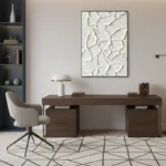 Textured hand-painted canvas depicting layered botanical foliage in cream and white relief, contemporary home office