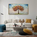 Contemporary landscape hand-painted canvas depicting vibrant autumn tree with red and gold foliage, soft blue sky, modern living space