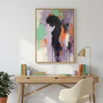 Gestural abstract expressionist hand-painted canvas with bold black silhouette and vibrant purple, green, orange palette, modern workspace